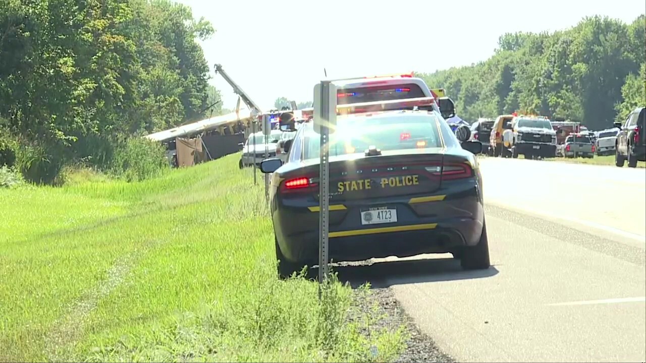 Crews flip tour bus after fatal highway crash in New York