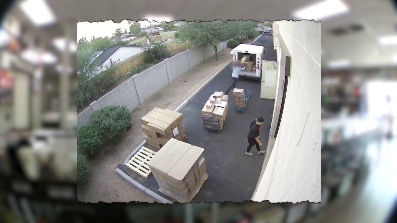 Postal worker caught on camera throwing packages