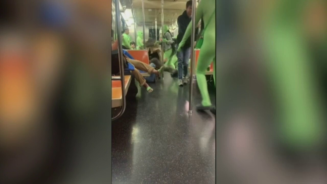 Group of women dressed in green body suits attack women on the NYC subway