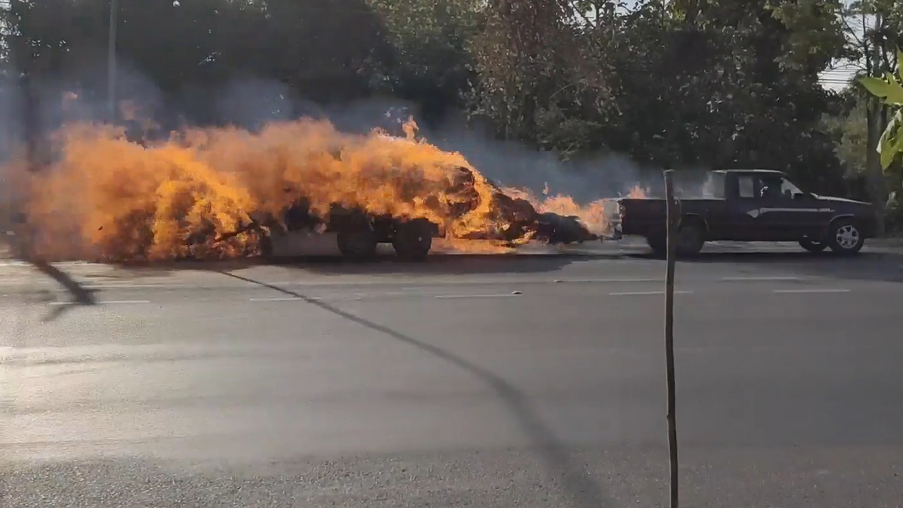 Flaming truck speeds through town