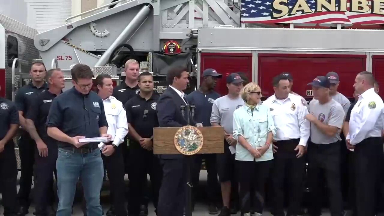 Florida Gov. Ron DeSantis hand delivers $1,000 bonus to first responders working Hurricane Ian response