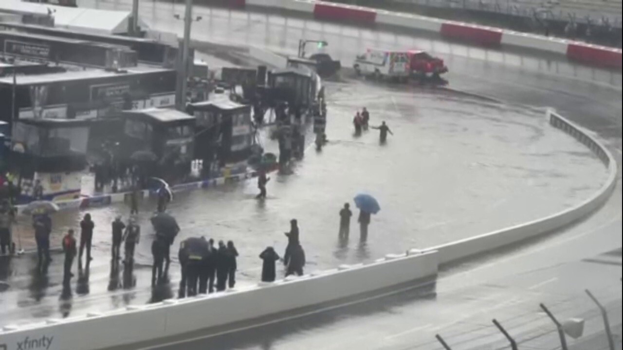 NASCAR driver belly-flops into flood on pit road