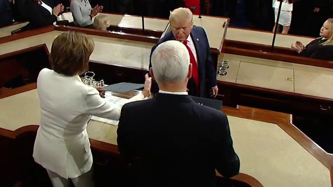 Handshake snub? President Trump appears to ignore Nancy Pelosi's outstretched hand at State of the Union	