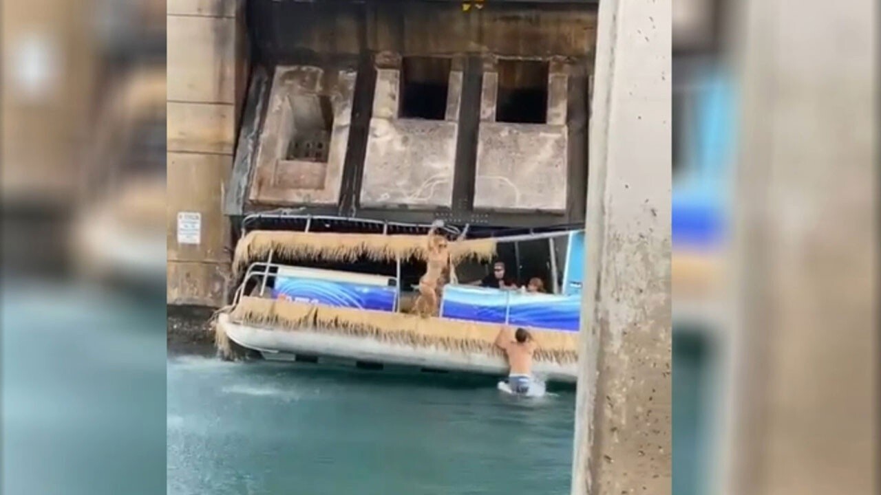 Rising Florida drawbridge partially crushes pontoon boat