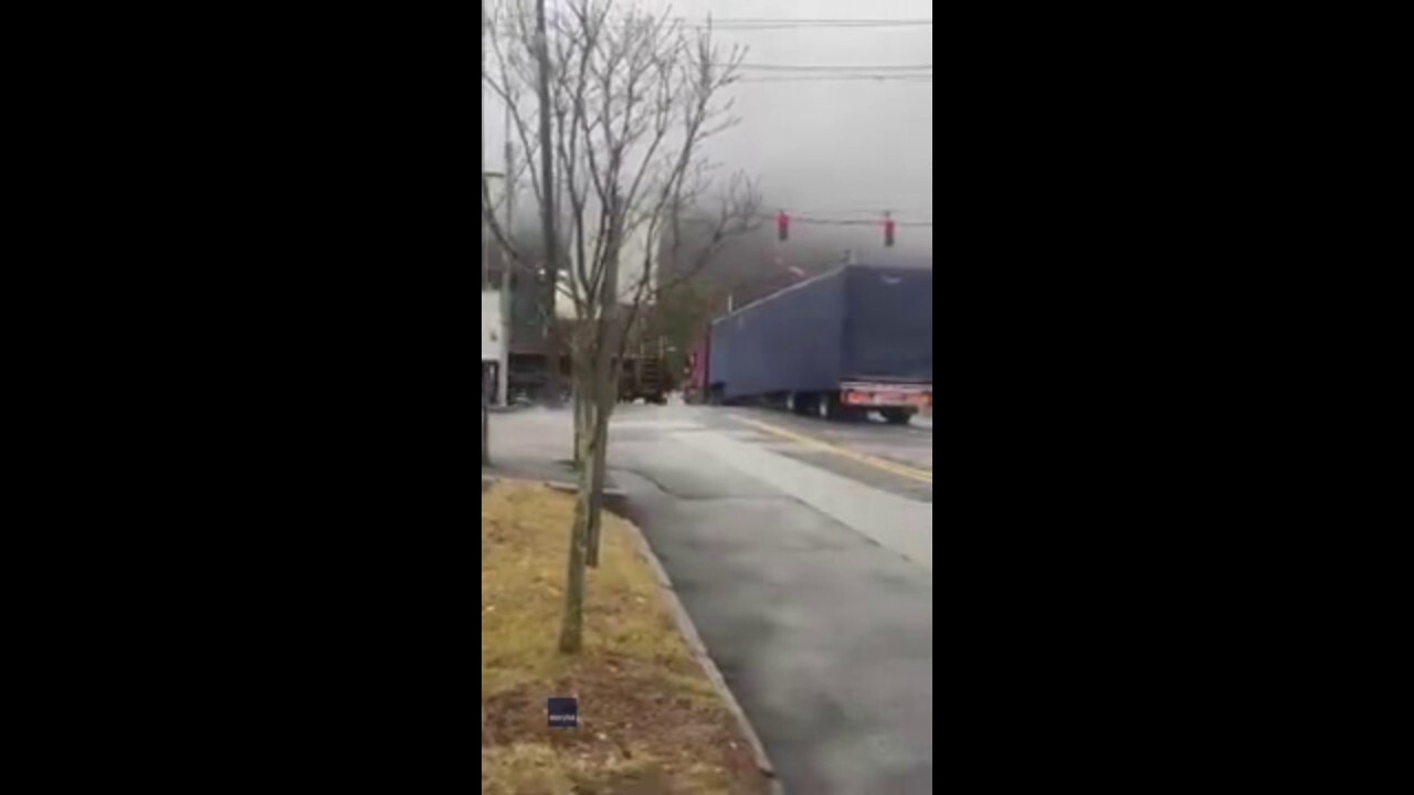 Train slams into tractor-trailer while stopped on tracks: See the horrific video