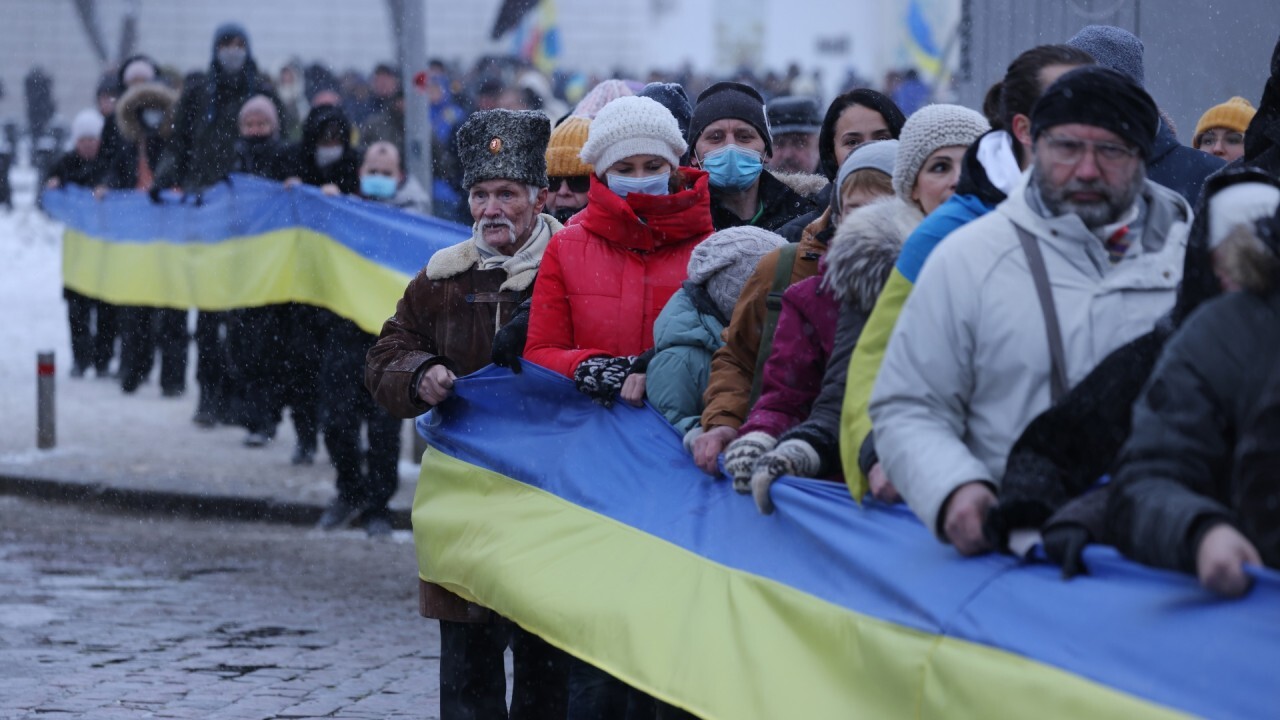 Ukraine citizens going about ordinary business despite warnings of war