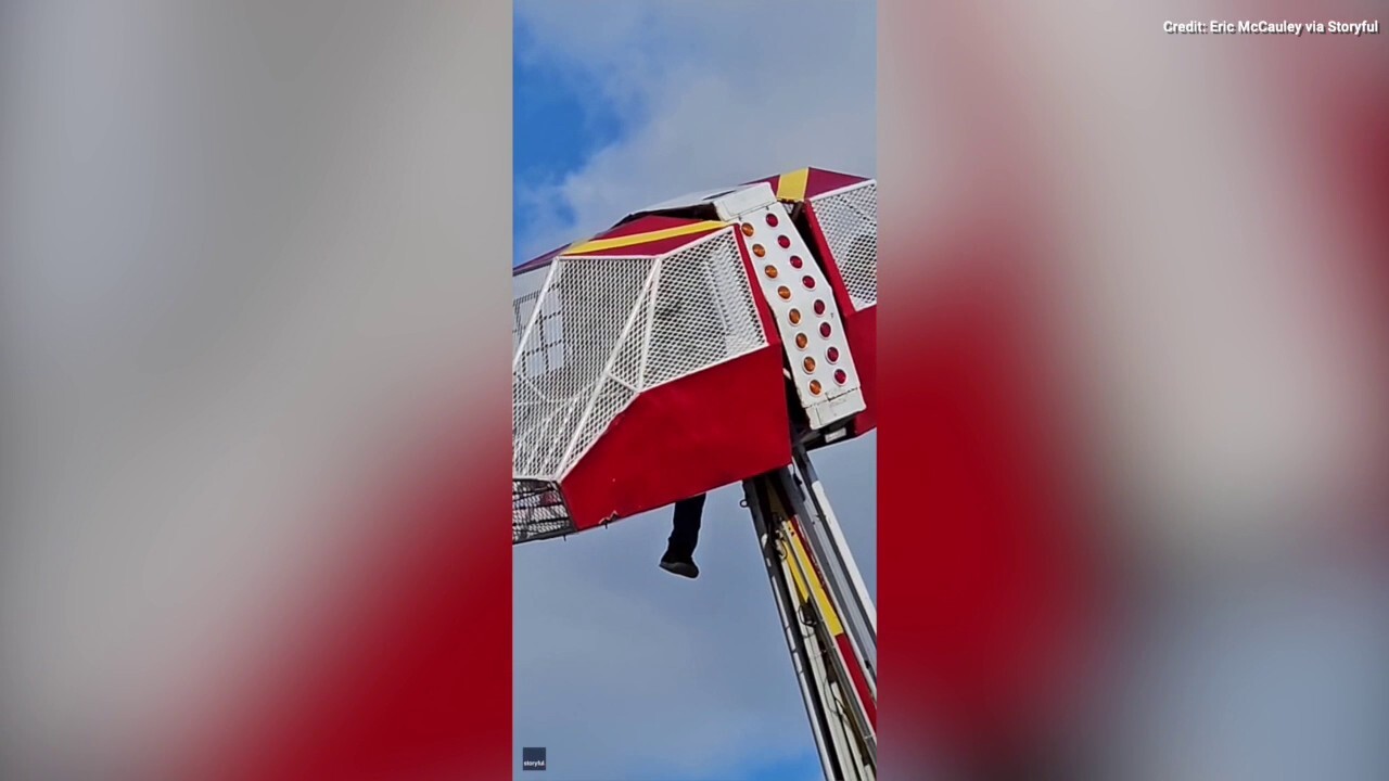Texas carnival worker holds on to ride while protecting child after mishap