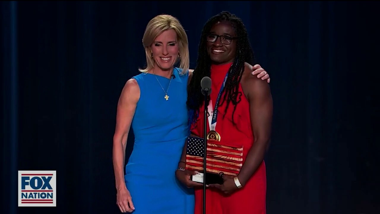 Olympic gold medalist Tamyra Mensah-Stock receives the award for Most Valuable Patriot at the 2021 Fox Nation Patriot Awards