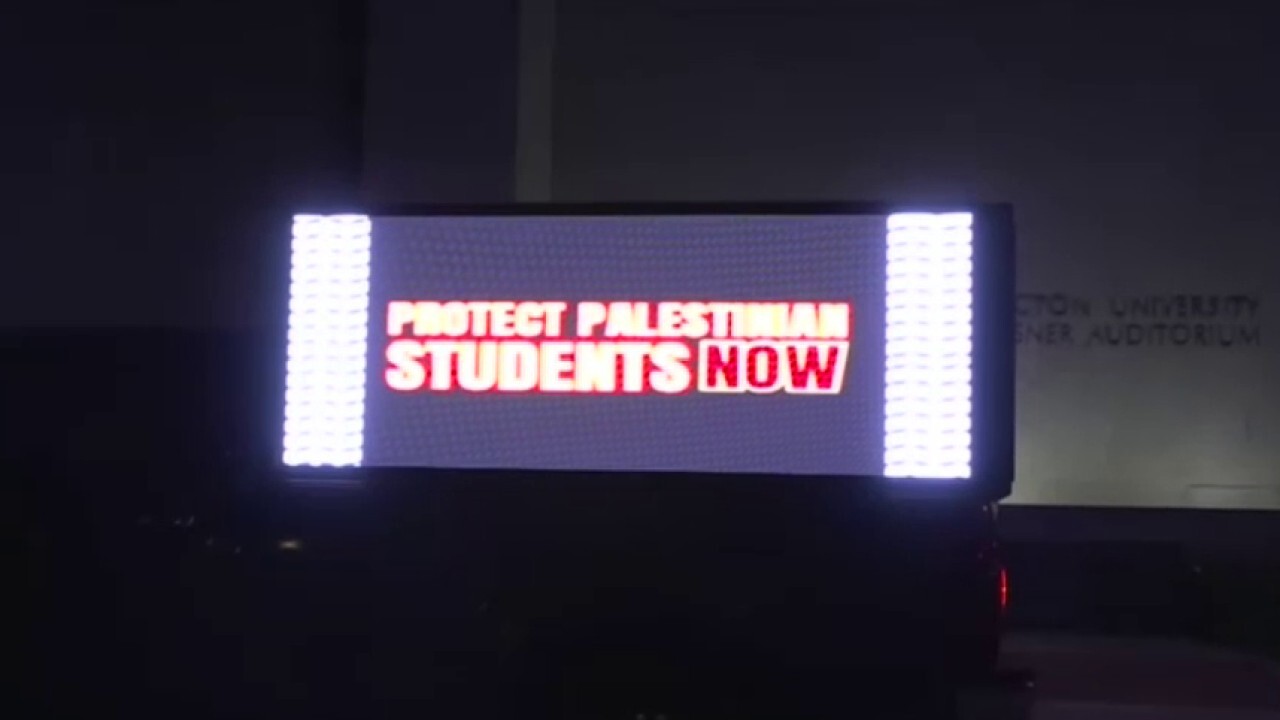A truck displaying anti-Israel slogans parks at George Washington University Campus