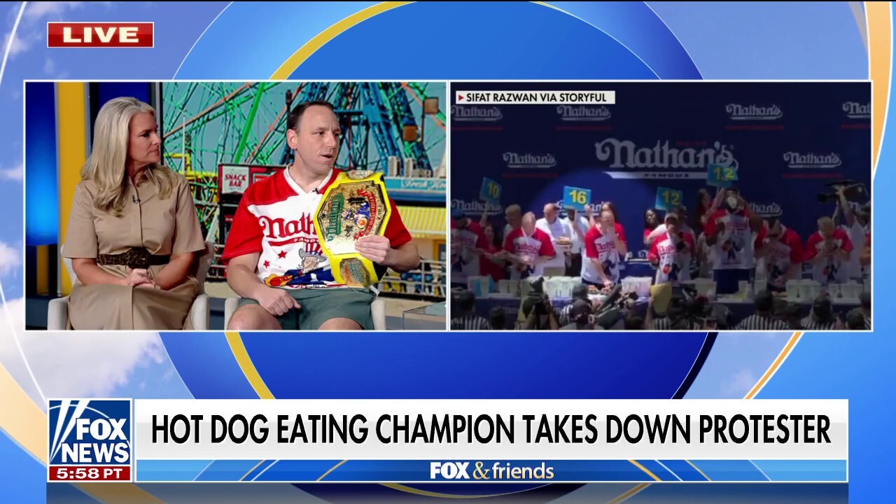 Joey Chestnut wins Nathan's hot dog competition, takes down protester