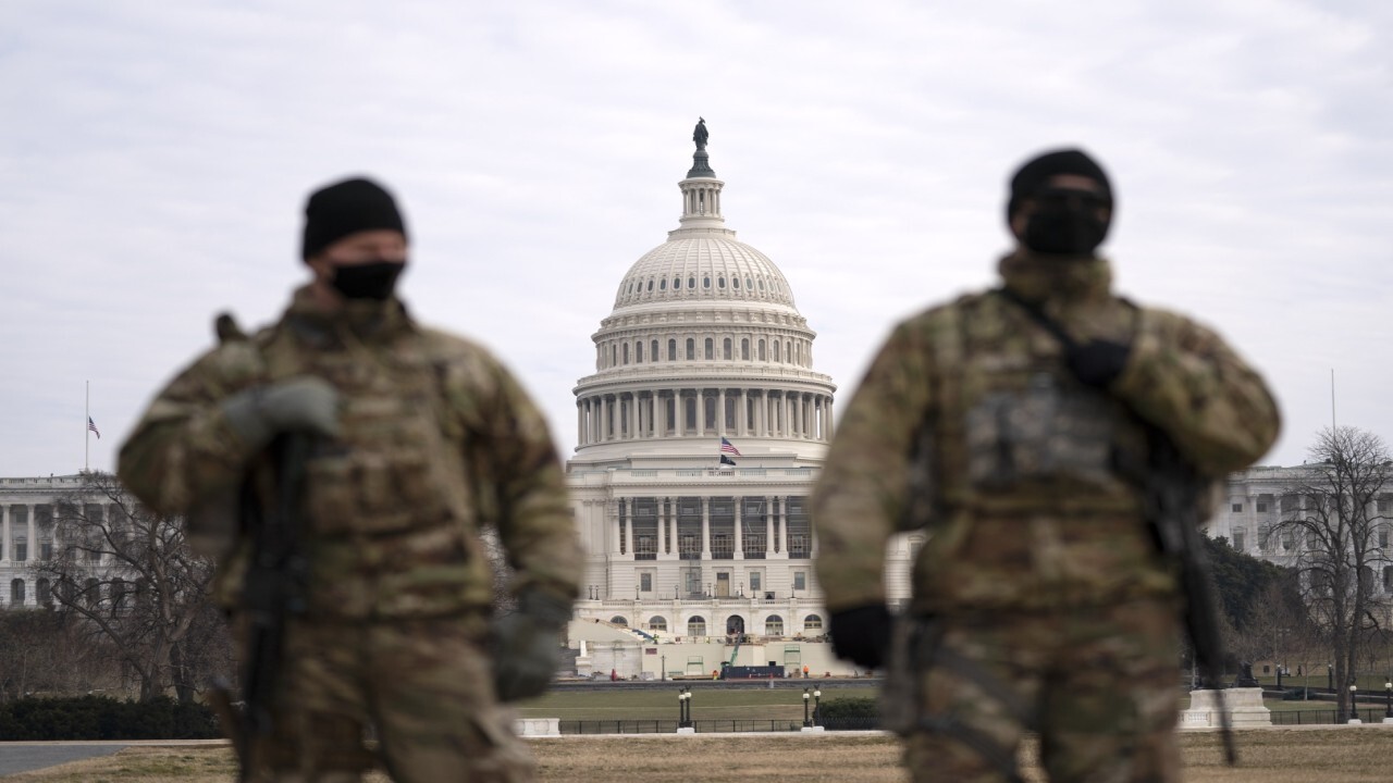 Why is the National Guard extending its stay in Washington?