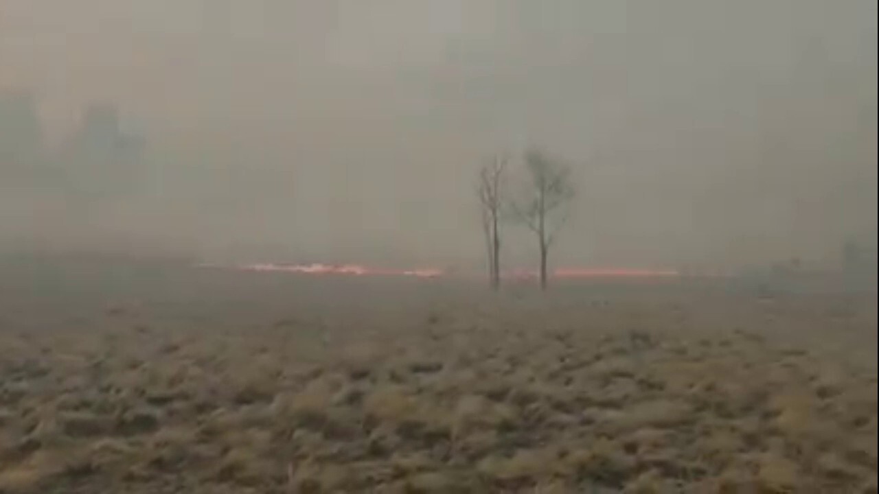 Colorado firefighters battle thick smoke during massive wildfire