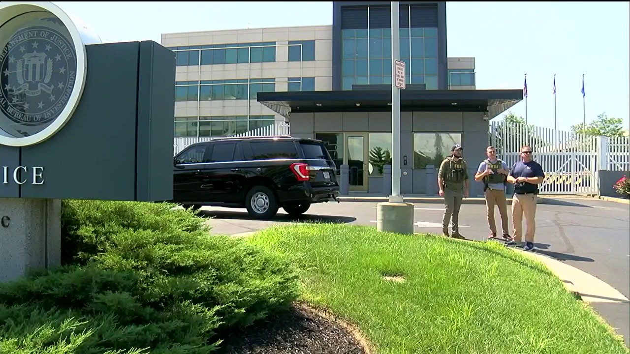 Authorities hold a press conference after an armed man attempted to breach an FBI field office