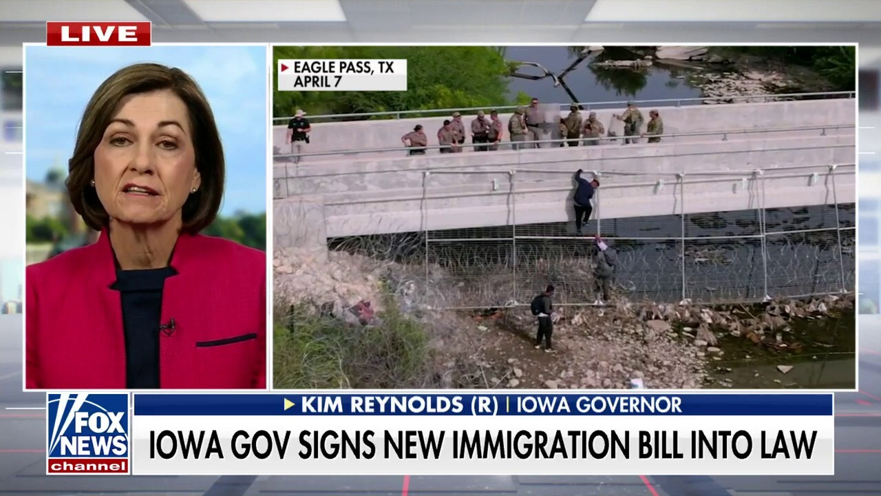 Gov. Kim Reynolds signs bill aiming to curb illegal immigration by empowering law enforcement