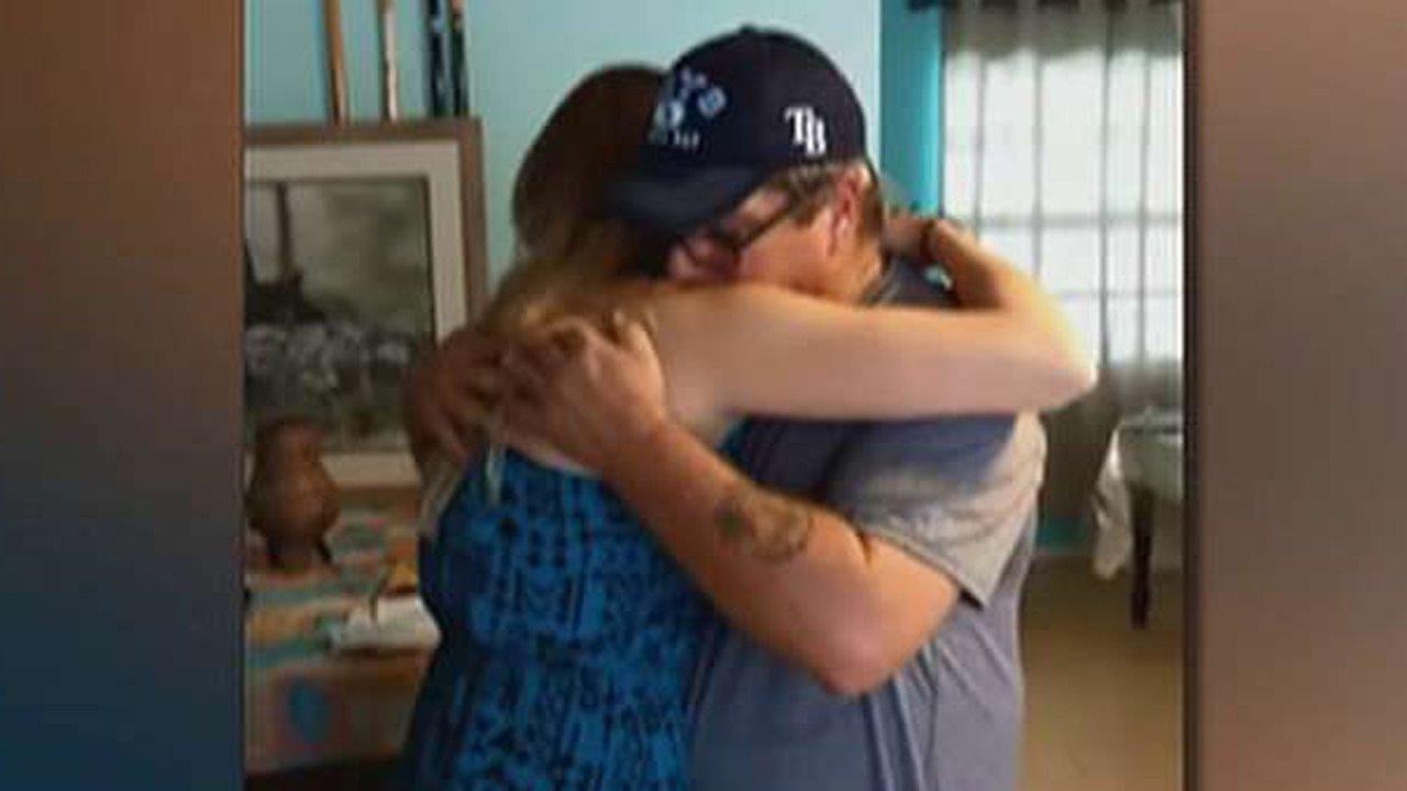 Stepdad brought to tears by daughter's gift: Adoption papers
