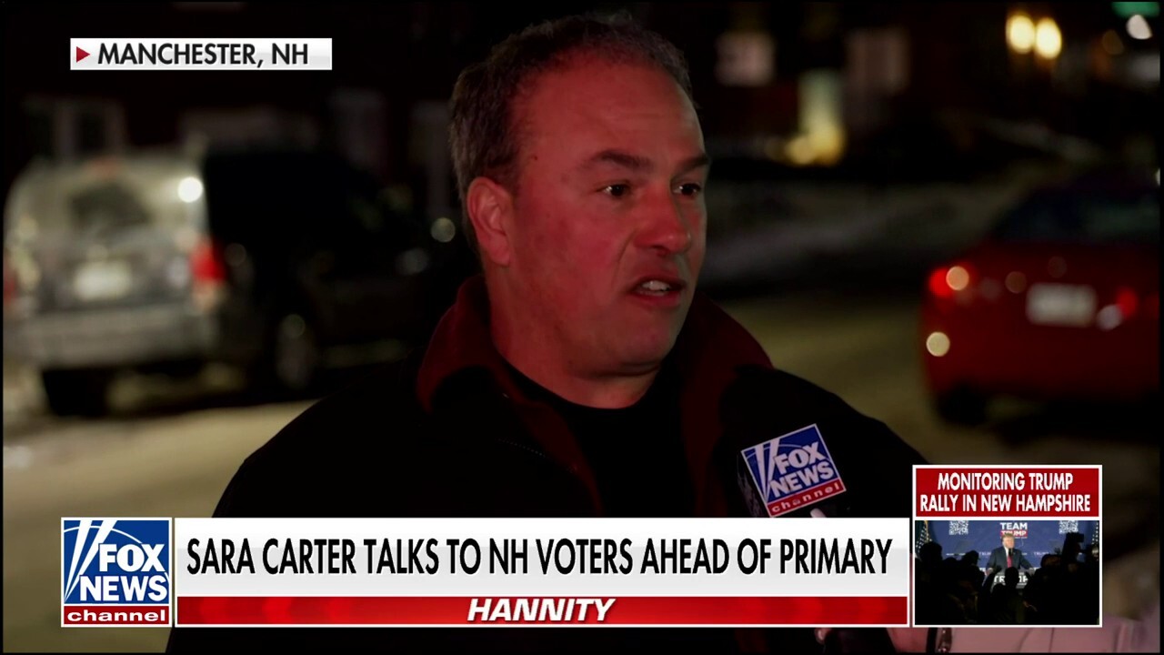 Sara Carter chats with New Hampshire voters as they prepare to cast their ballots