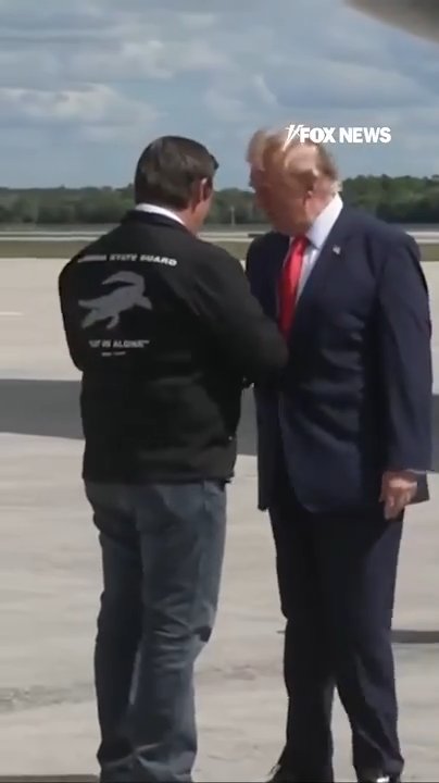 DeSantis greets Trump with a coin upon visit to Florida