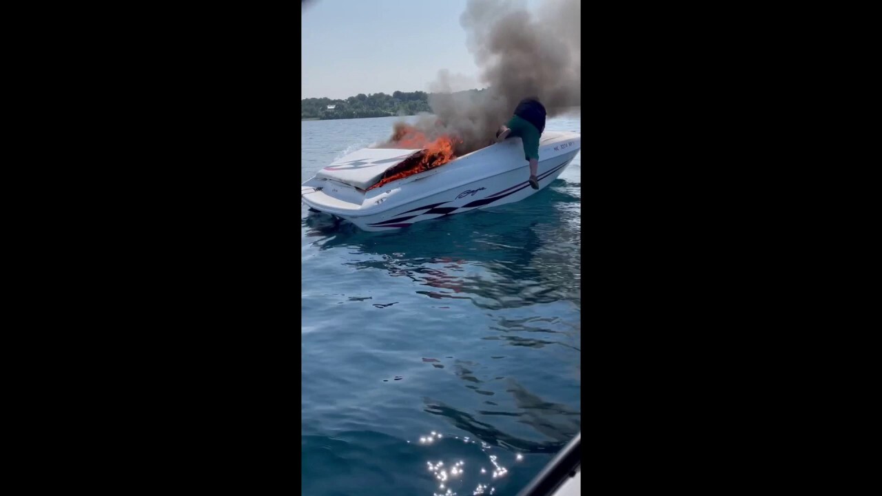 Michigan boaters leap into water before flames consume vessel