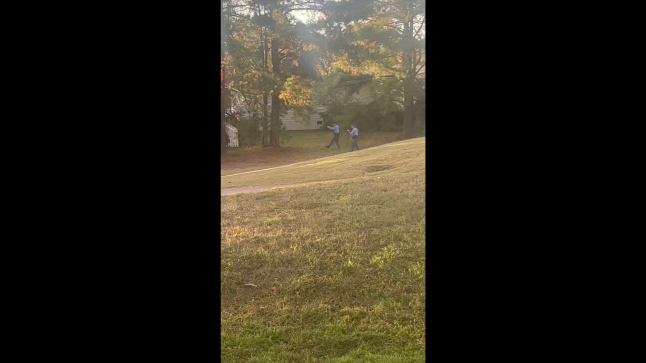 Video shows armed officers passing in front of house in Raleigh, NC