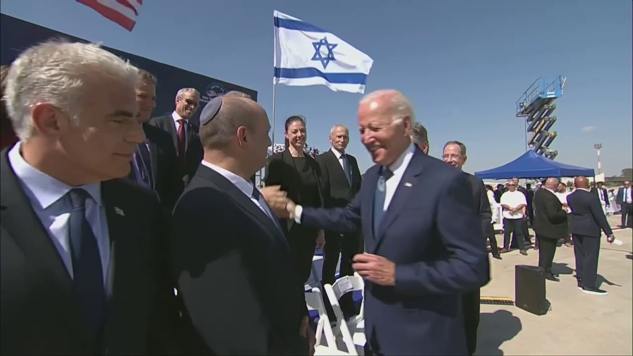 Biden shakes hands with Netanyahu during Middle East trip