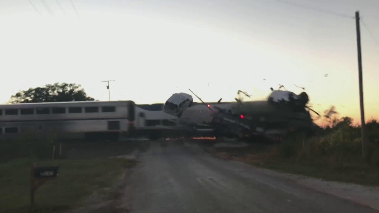 An Amtrak train collided with a semi-truck hauling cars in Oklahoma on Friday, leaving four train passengers with minor injuries.