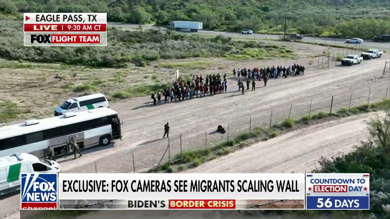 Fox News video captures migrants in camo scaling Arizona wall