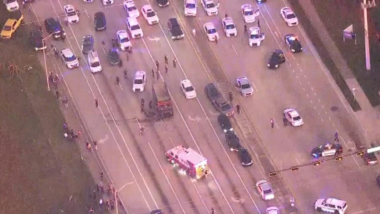 Raw video: Massive police chase concludes as dozens of officers surround UPS truck stolen by robbery suspects	