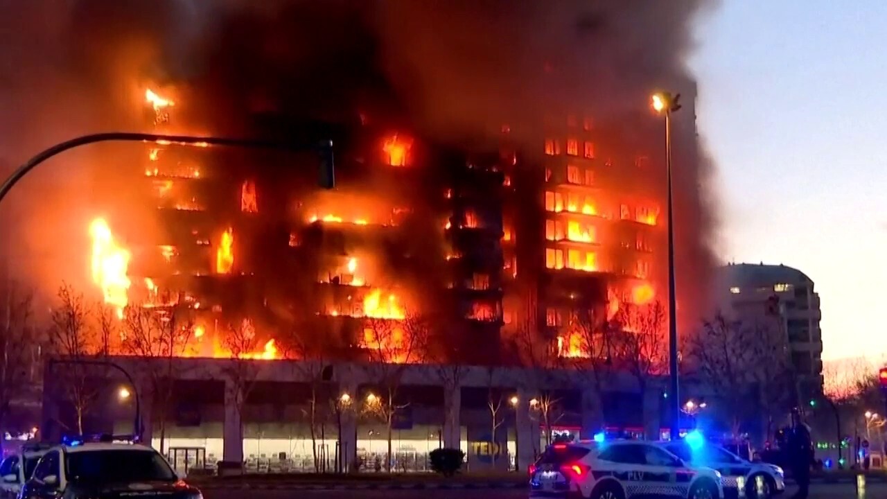 At least 4 dead, 14 missing as massive fire tears through residential building