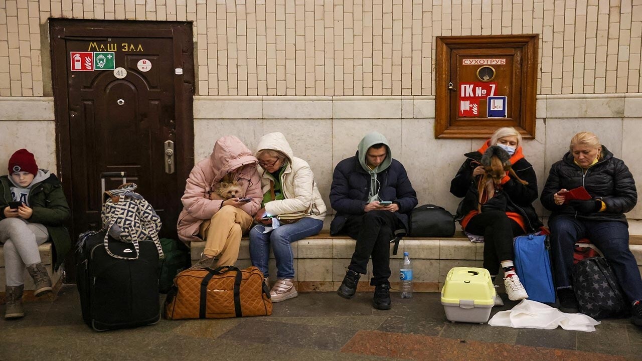 Ukrainian civilians go underground to hide in Kyiv metro stations