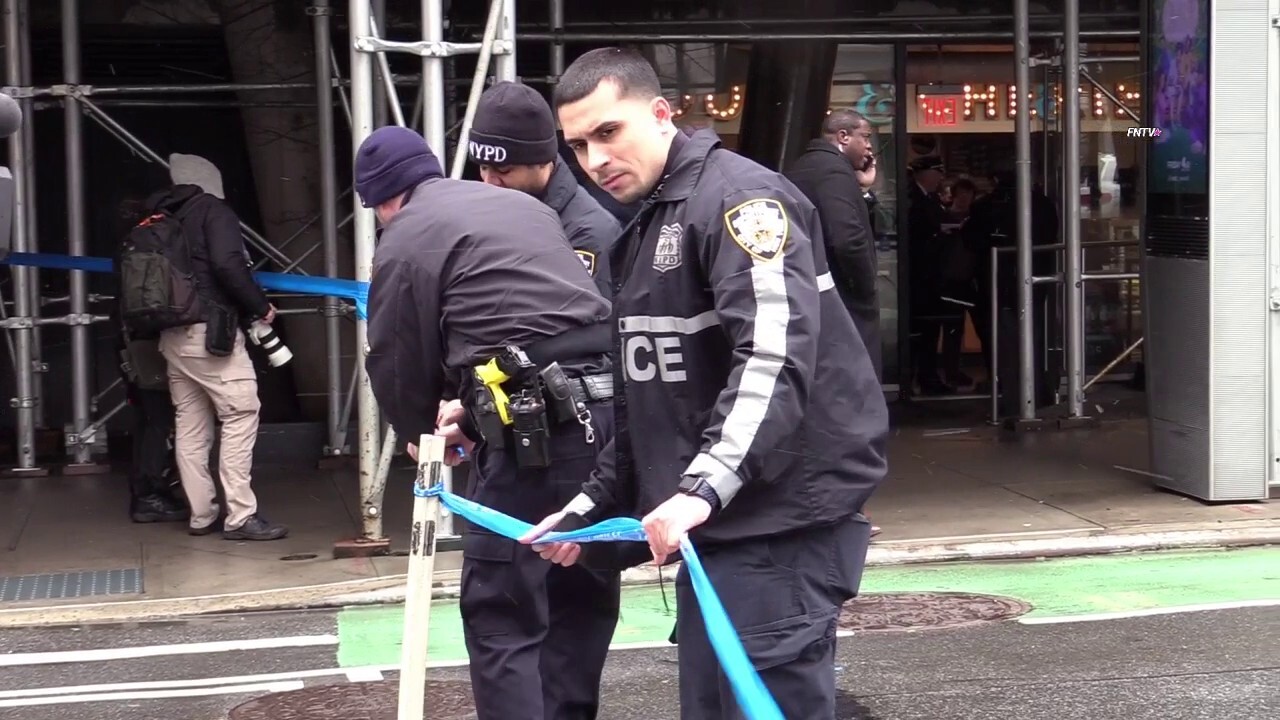Police respond after a 17-year-old is shot near a Manhattan school