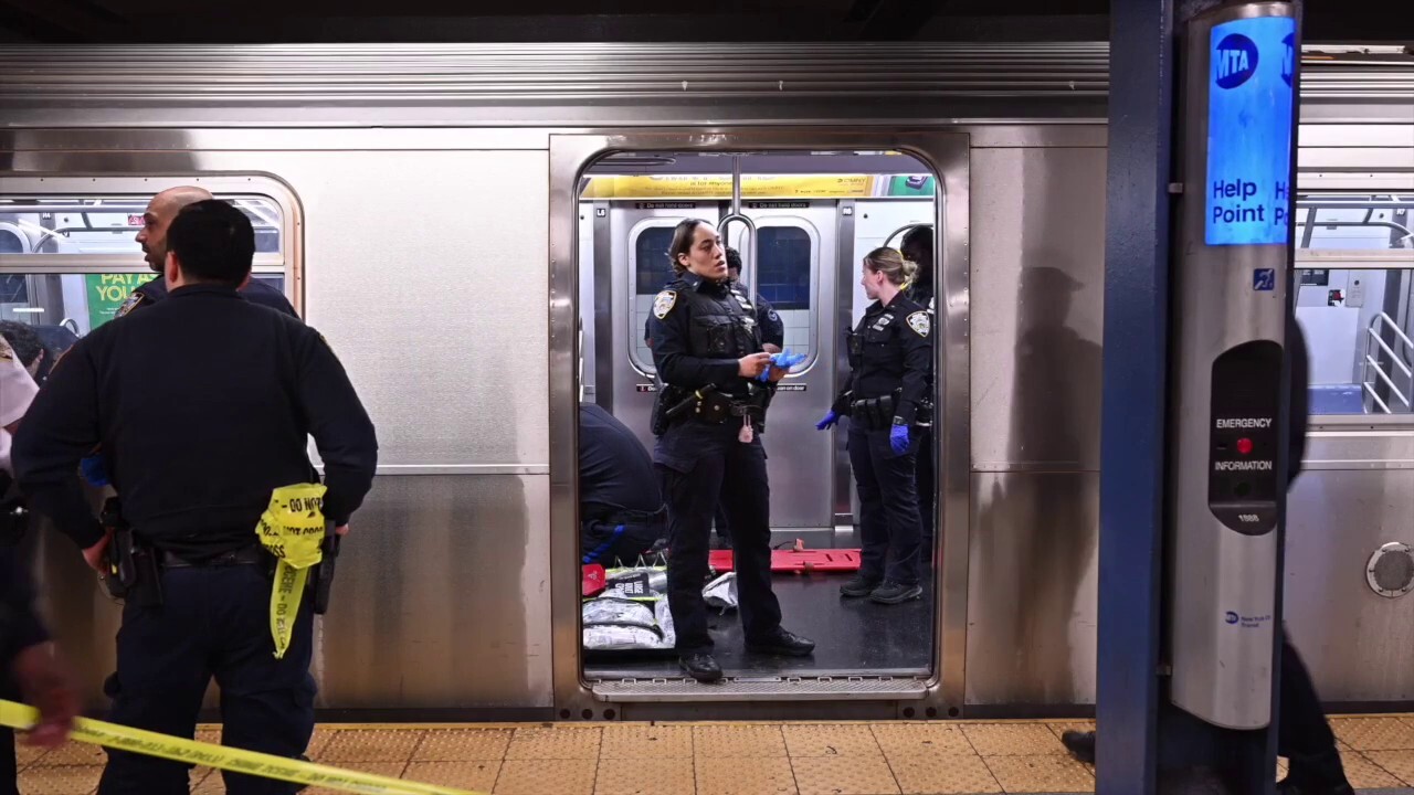 NYPD officers perform CPR on a man in the subway