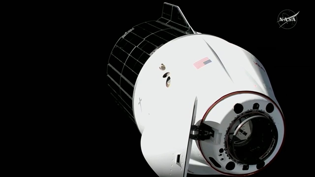 Uncrewed SpaceX Dragon spacecraft docks with space station for cargo delivery