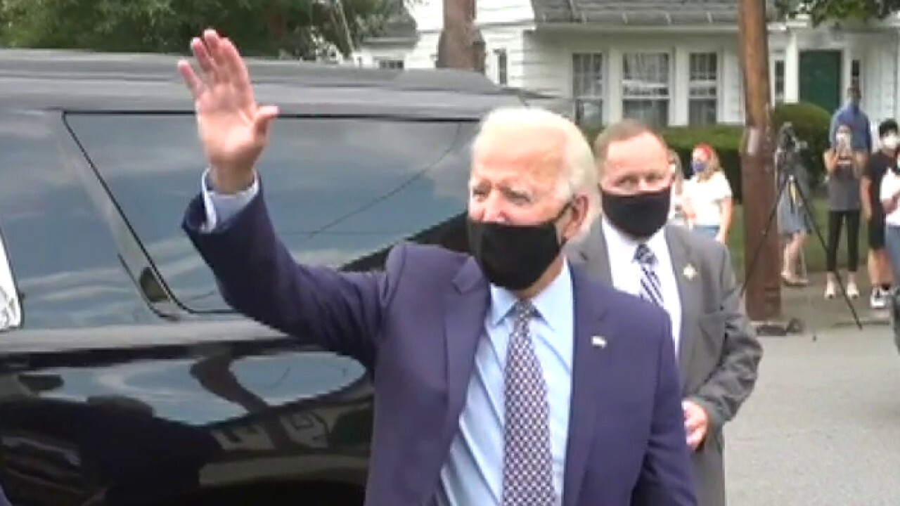 Biden pauses for photos outside of his childhood home in Pennsylvania	