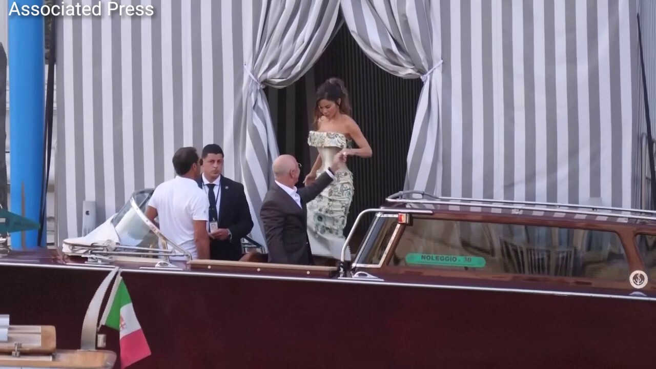 Jeff Bezos and Lauren Sánchez step out of their hotel and onto a water taxi ahead of their wedding
