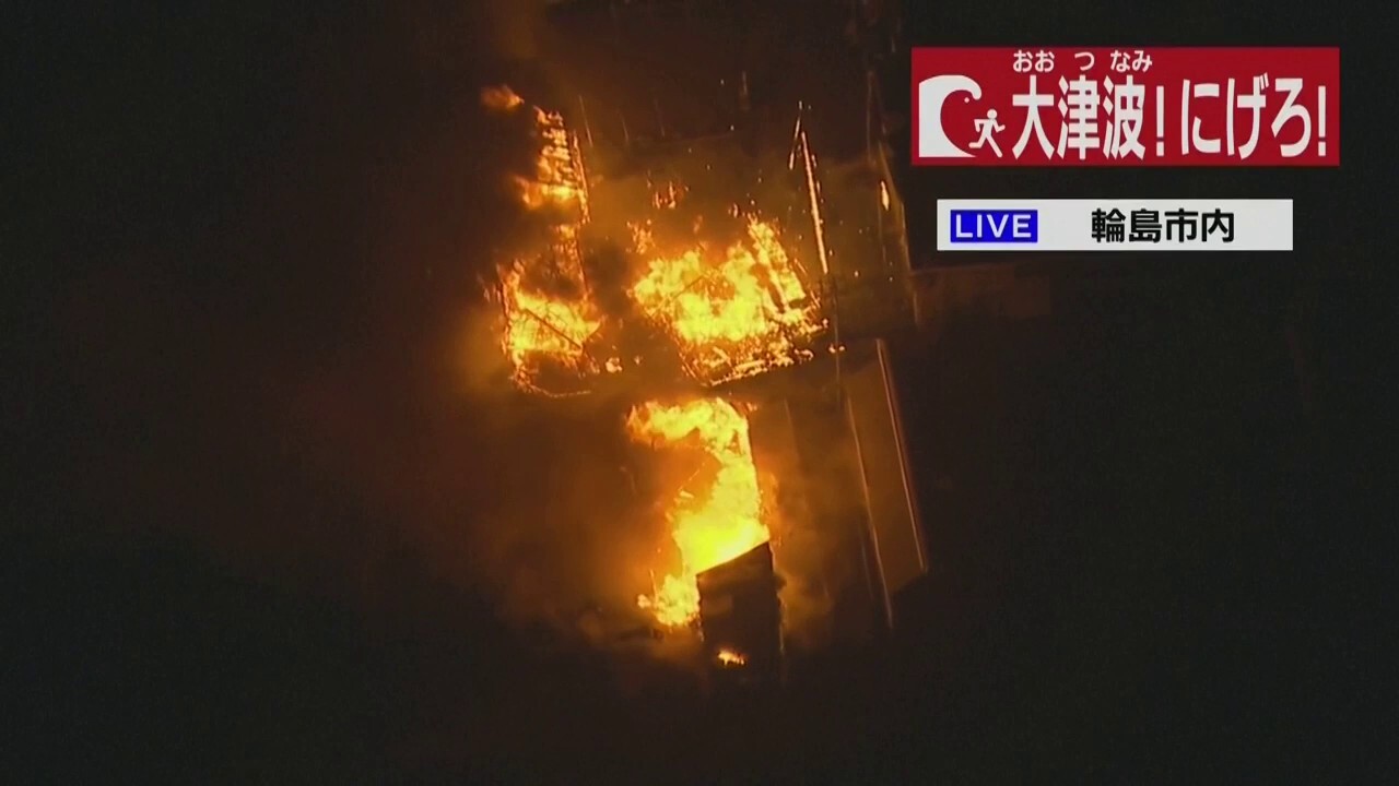 Japan earthquake blamed for fire as country issues tsunami warnings