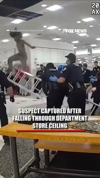 Suspect captured after FALLING through store CEILING