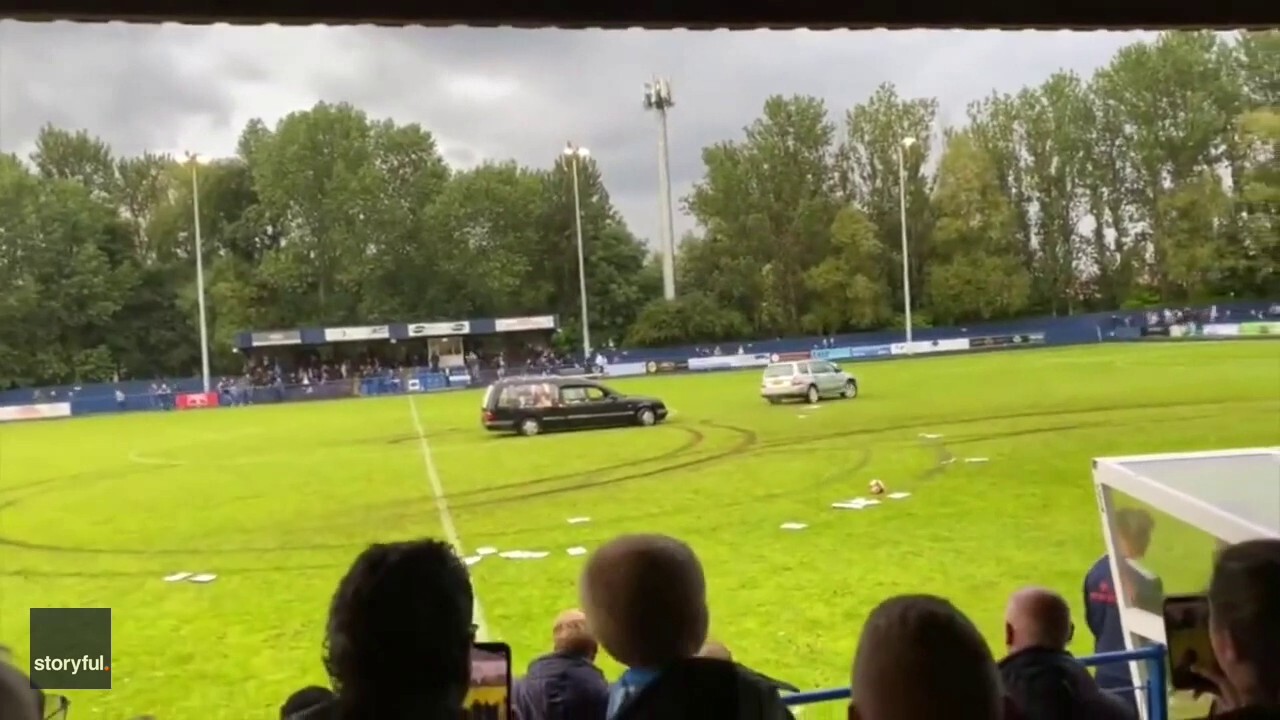 Chaos at an English soccer game as a hearse speeds out onto the field