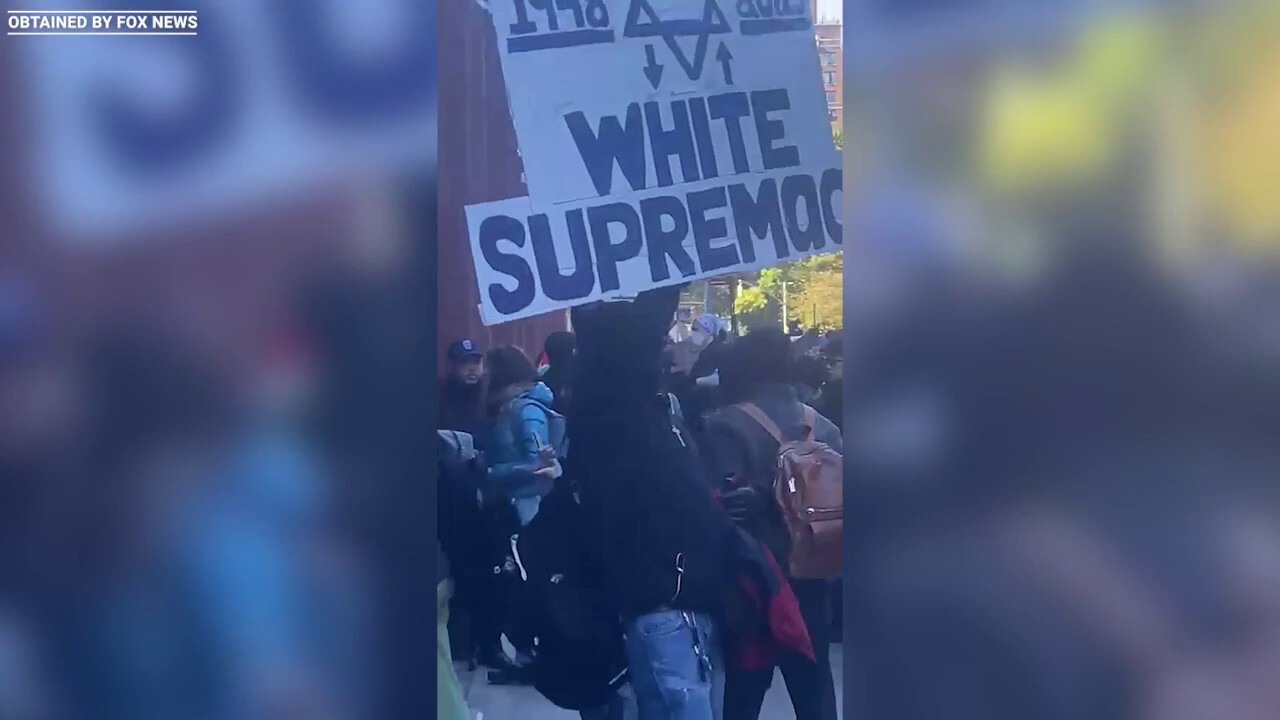 Protester at NYU holds giant 'Jewish Supremacy' sign