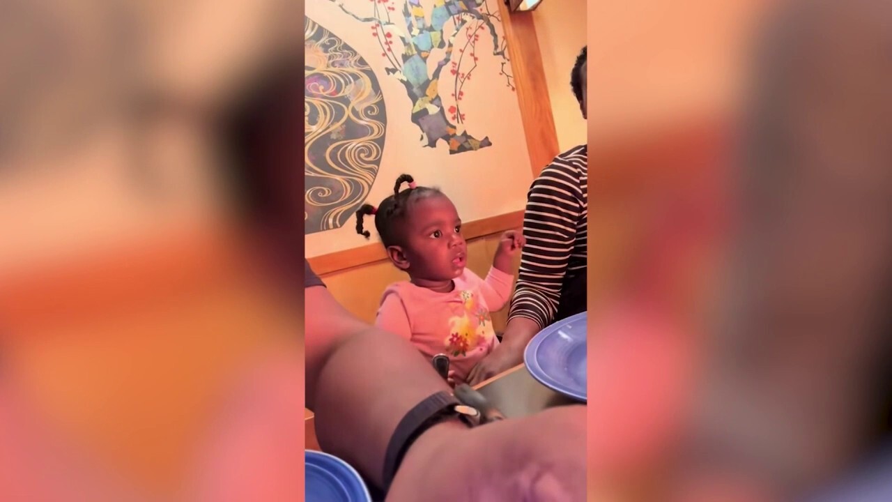 Baby awestruck by first hibachi restaurant experience