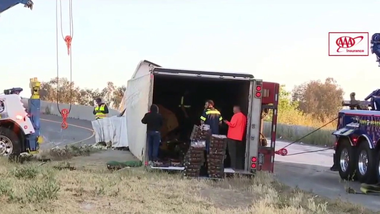 Overturned tractor trailer carrying 40,000 pounds of strawberries creates traffic jam