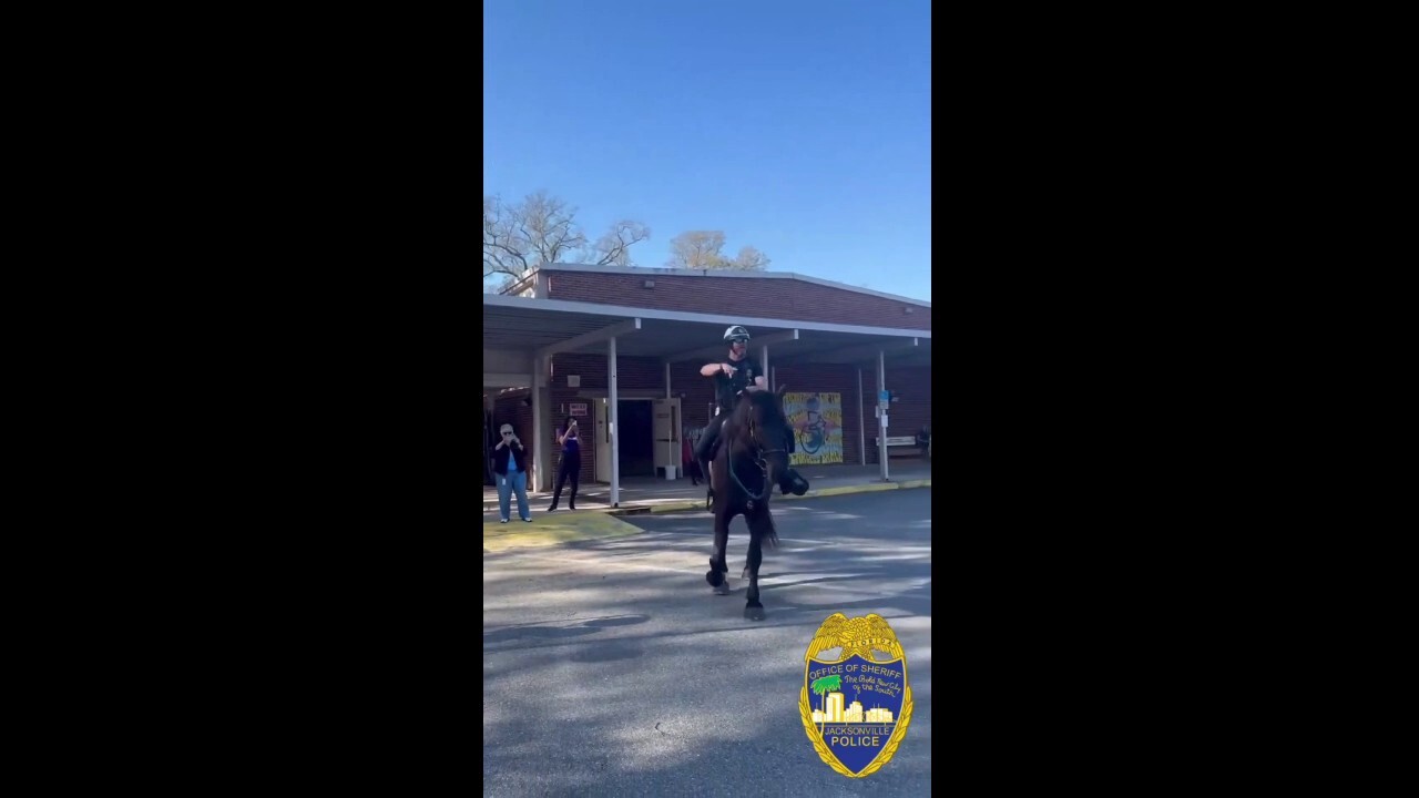 Police sergeant scores a basket while on horseback