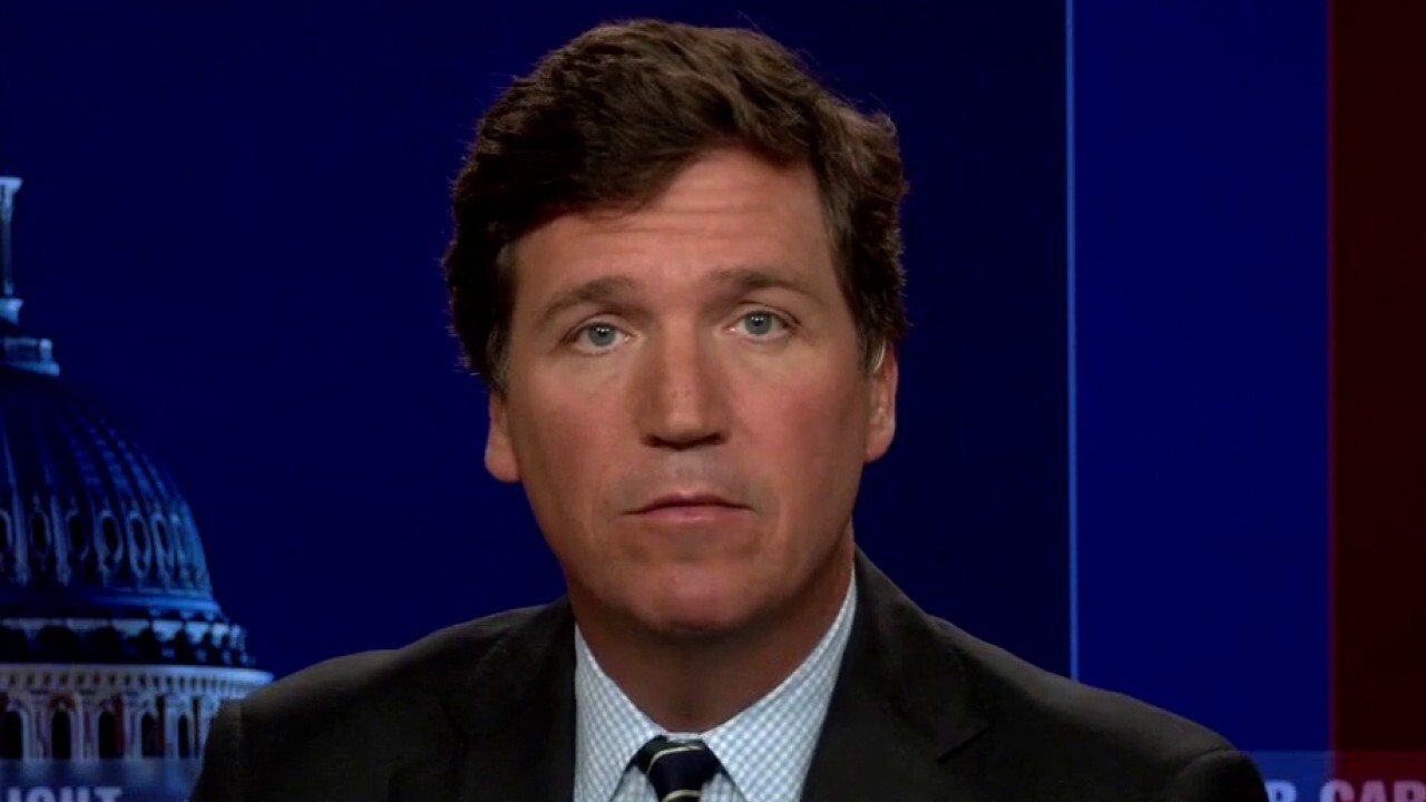 Tucker accuses journalist of 'covering up' and 'cheering on' surveillance state