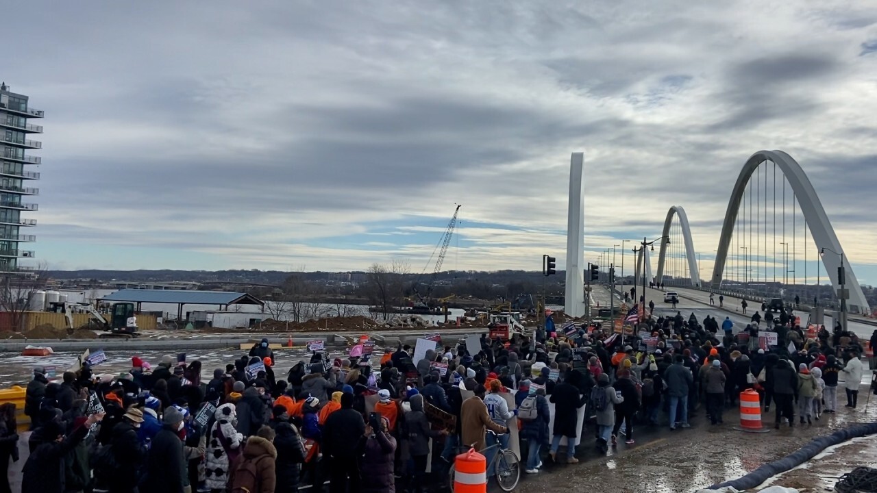 Hundreds march across Frederick Douglass Bridge for MLK Day, demand Congress pass voting legislation