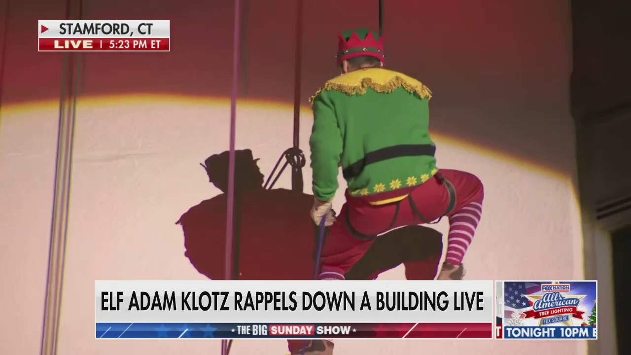 Adam Klotz rappels down a 22-story building