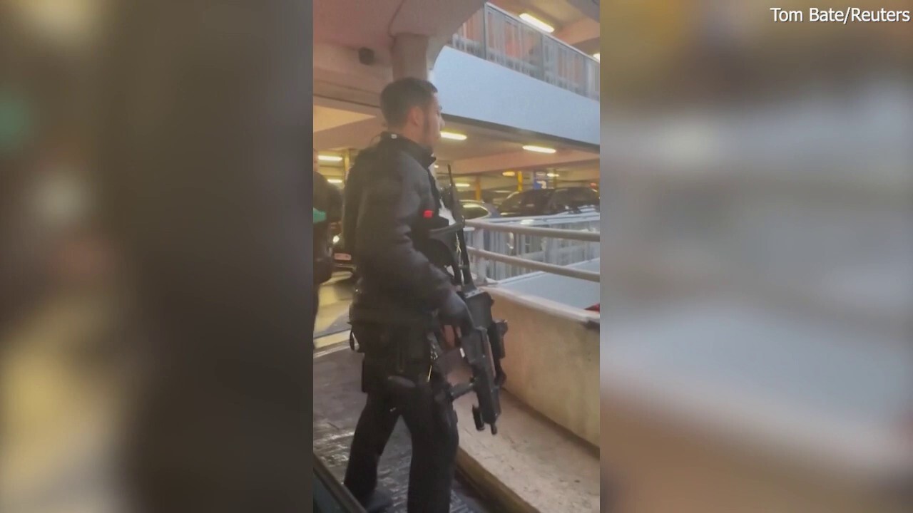 Police swarm parking garage after reports of assault rock London airport