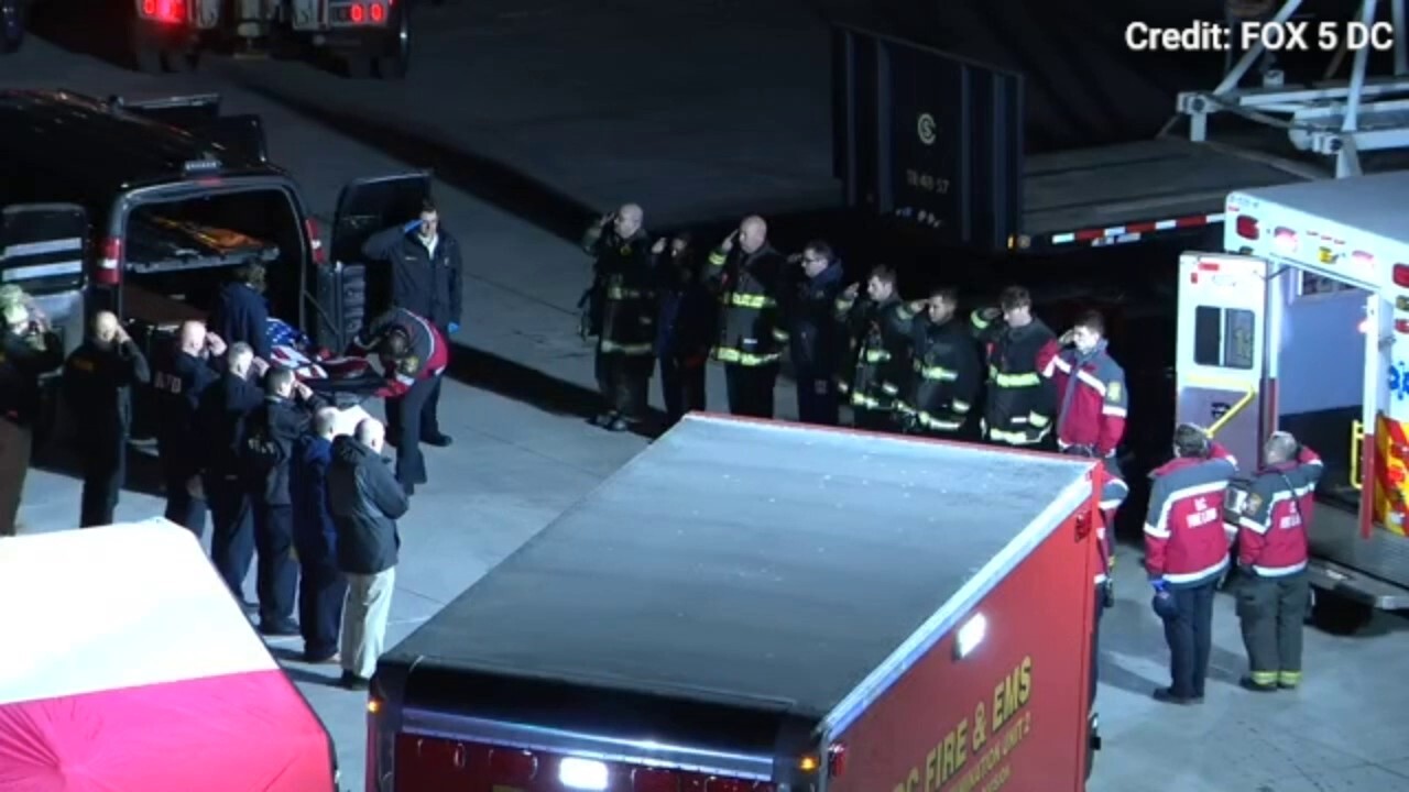 DC plane crash: First responders honor flag draped remains