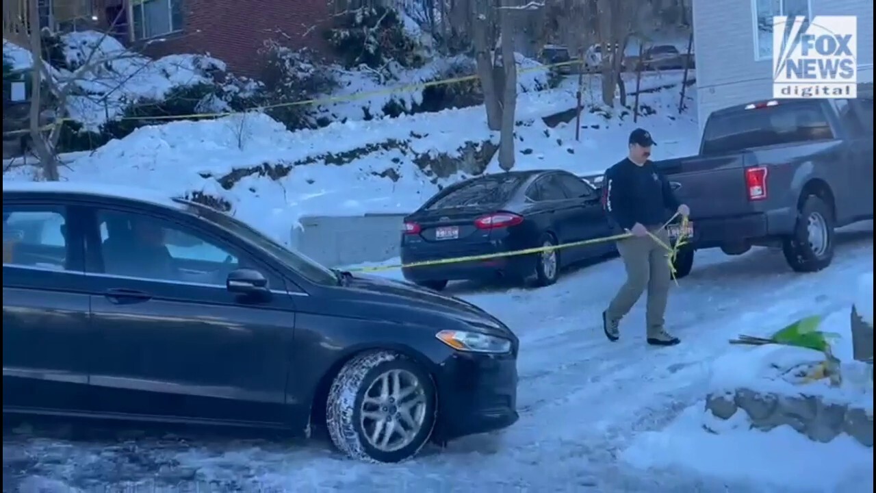 Police leave the house of the Idaho murders