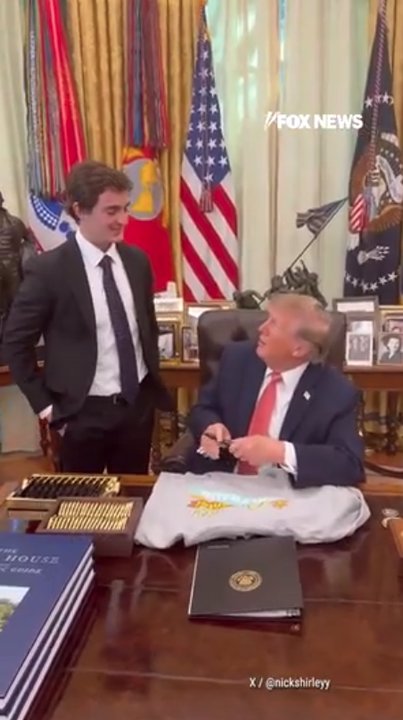 Trump signs sweatshirt for journalist Nick Shirley after fraud briefing
