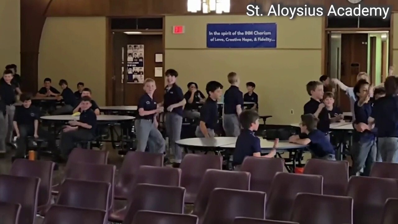 Students at St. Aloysius Academy in Pennsylvania cheer after Pope XIV appointment