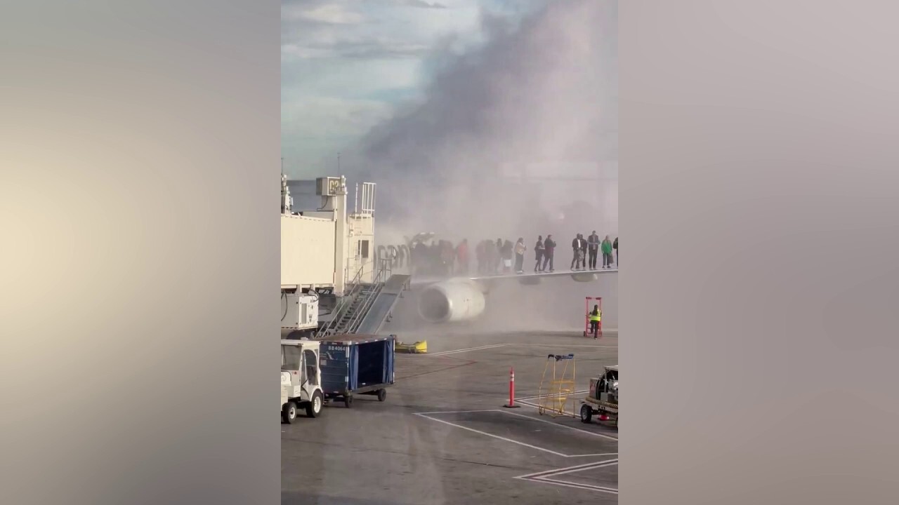 American Airlines plane catches fire at Denver International Airport ...